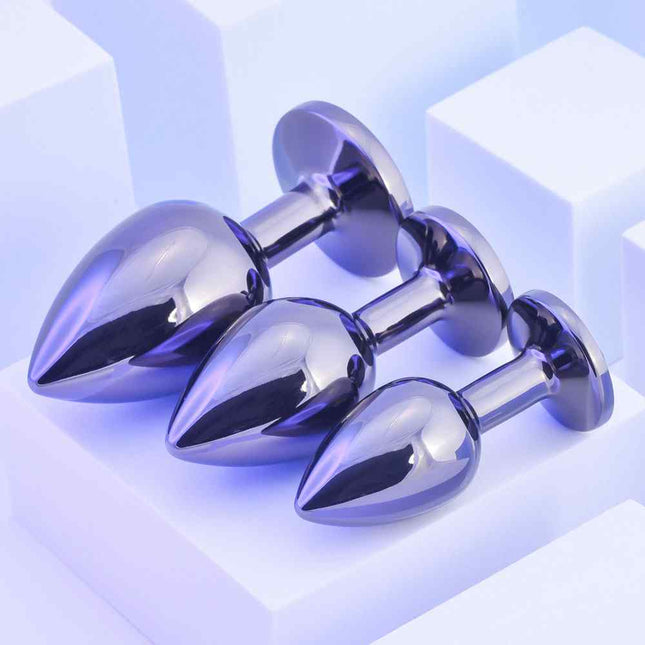 3 Playboy Metal Butt Plugs on a stand