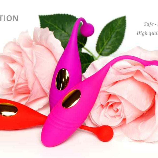 Dual Vibrating Egg Massager in Pink, Purple and Red on top of Flowers