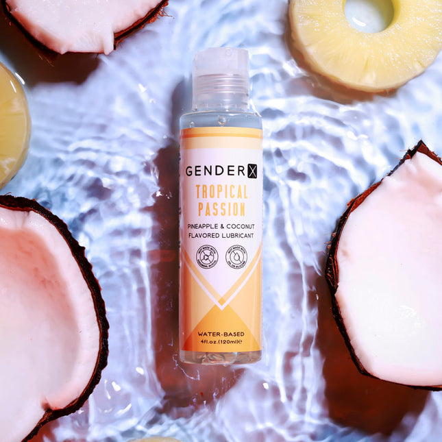 Gender X TROPICAL PASSION Flavoured Lube - 120 ml - Pineapple & Coconut Flavoured Water Based Lubricant Bottle Top View with Coconuts Background