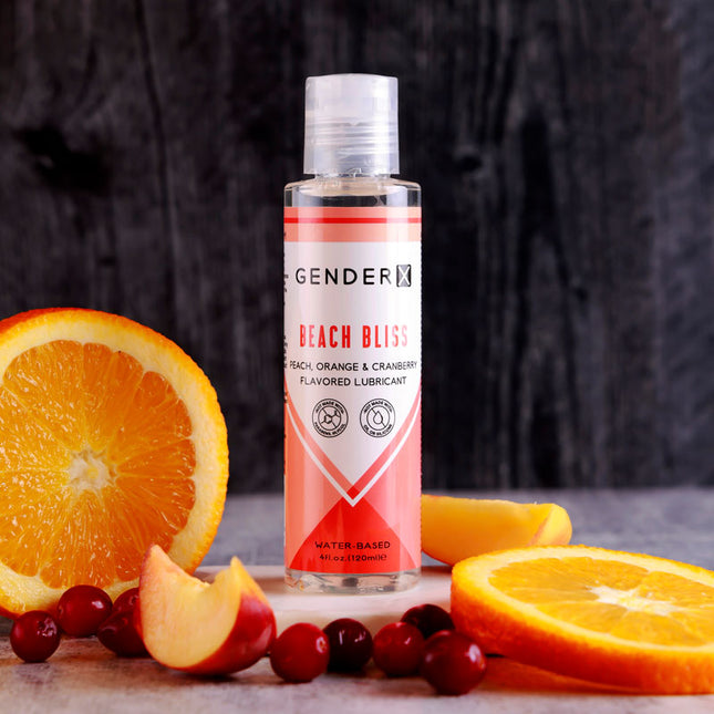 Gender X Beach Bliss Peach, Orange & Cranberry Flavoured Water Based Lubricant - 120 ml Bottle with Oranges in background