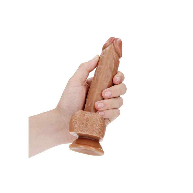 Hand Holding Tan REALROCK 7 Inch Realistic Suction Cup Dildo with Balls