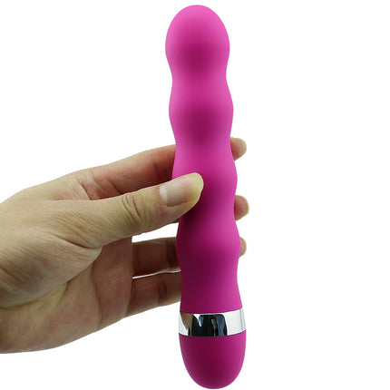 Hand Holding a Pink 10 Speed Silicone Ribbed Bullet Vibrator