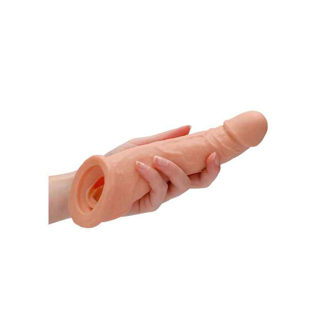 Man holding penis extender 8 Inch