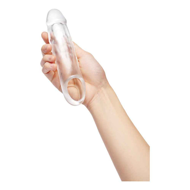 Mens hand holding Clear Size Up 1 Inch See-Thru Penis Extender with Ball Loop