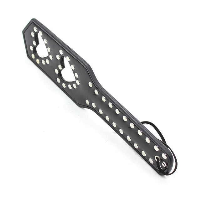 Side view of a loveheart spanking paddle