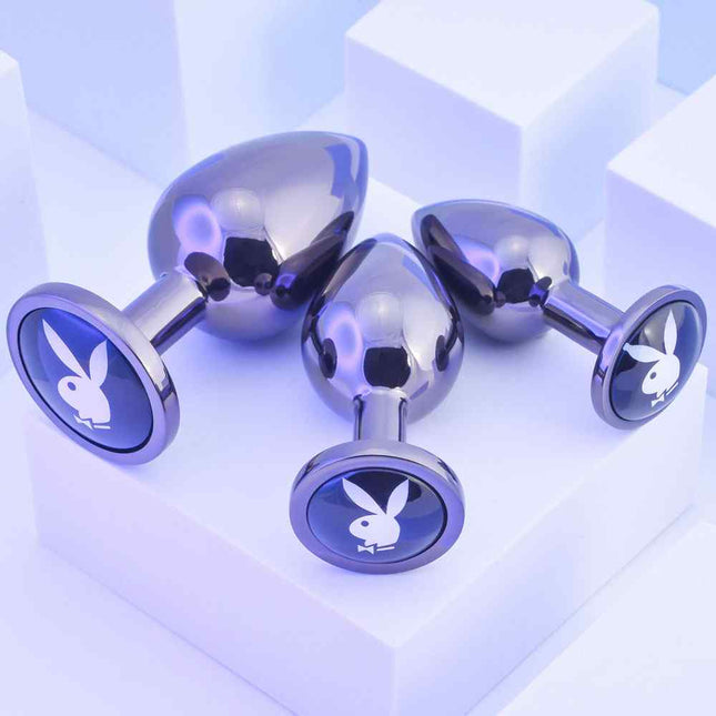 Size Comparison on stand of 3 Playboy metal butt plugs